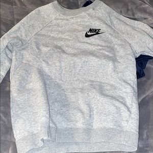 darker gray Nike sweatshirt, no hood